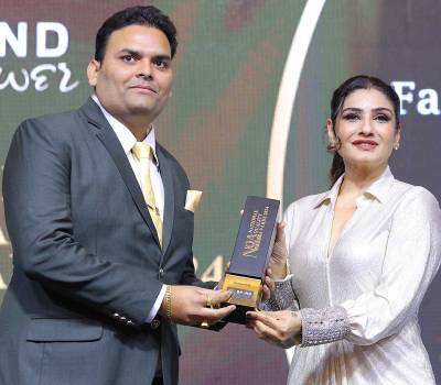 Magadh Transport Honored at NQA 2024 by Raveena Tandon